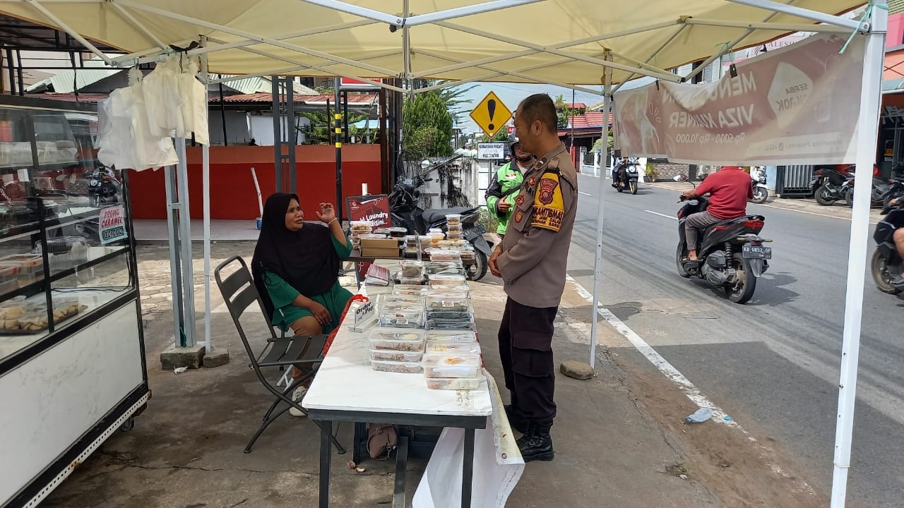 Bhabinkamtibmas Sei Jawi Dalam Ingatkan Pedagang Waspada Uang Palsu